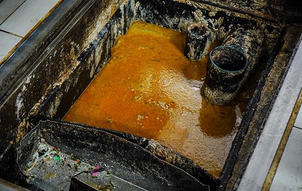 you should schedule grease trap cleaning for your dining establishment at least every 90 days to prevent build-up